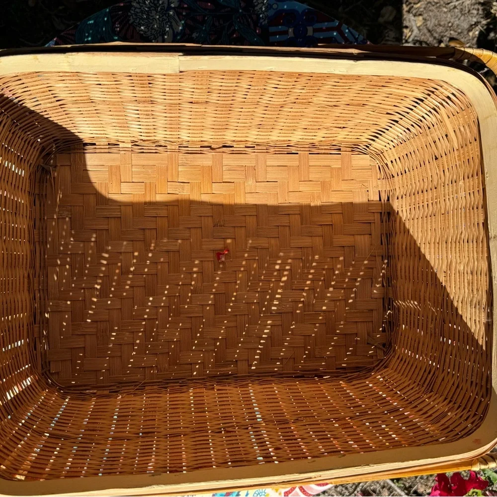 Large Vintage Handmade tan rattan picnic basket with handles.